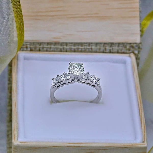Engagement Ring features 0.69ct Round cut Natural diamond and 6 Princess cut side Diamonds ENG-8750