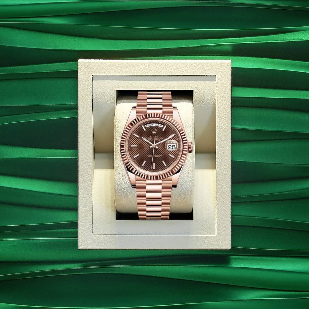 Rolex Day Date 40mm - Ref: 228235-0006 - Chocolate Diagonal Motif Stick Dial & Fluted Bezel, 18K Rose Gold President Bracelet Men's Watch