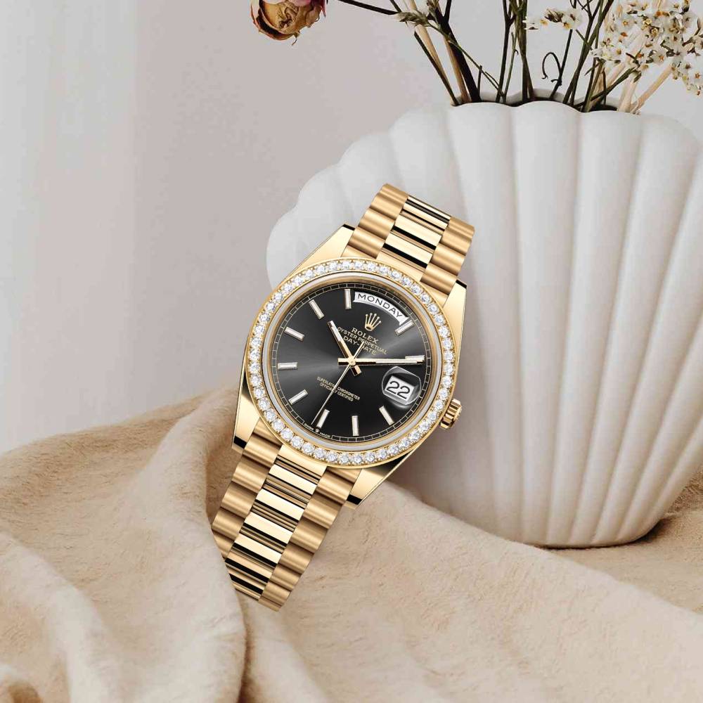 Rolex Day Date 40mm - Ref: 228348RBR - Black Stick Dial & Diamond Bezel, 18K Yellow Gold President Bracelet Men's Watch