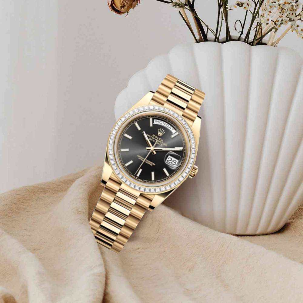 Rolex Day Date 40mm - Ref: 228398TBR - Black Stick Dial & Diamond Bezel, 18K Yellow Gold President Bracelet Men's Watch