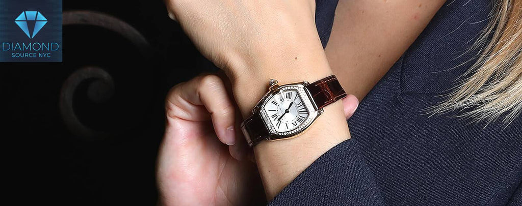 A close-up of a Cartier luxury watch highlighting its brand and model.