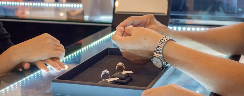 Jewelry buyer carefully examining a necklace before purchase