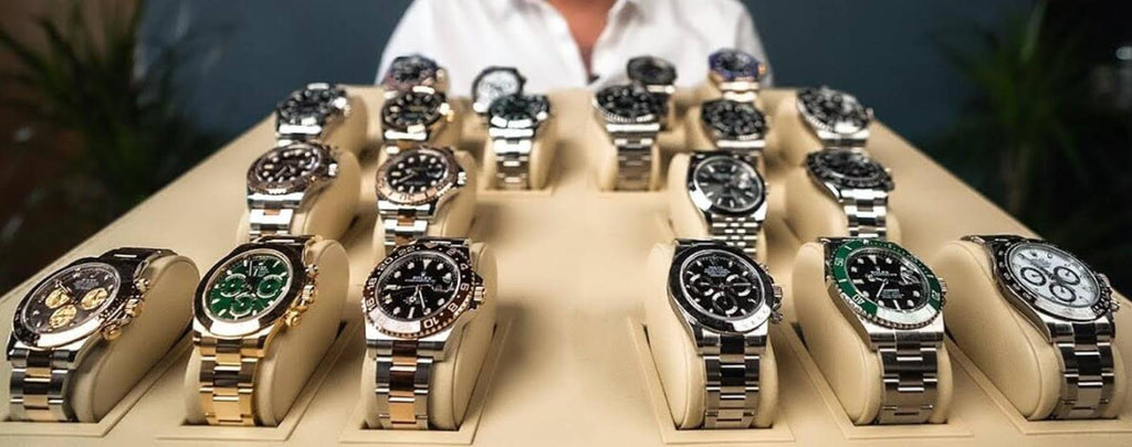 Gavel striking the podium at a high-end watch auction.