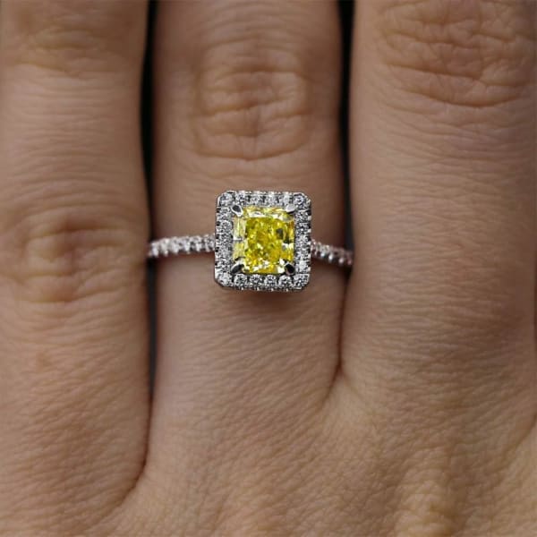 Classic Elegant Platinum engagement ring with center 1.05 Radiant Fancy Yellow Diamond DS-4564500, Ring on a finger