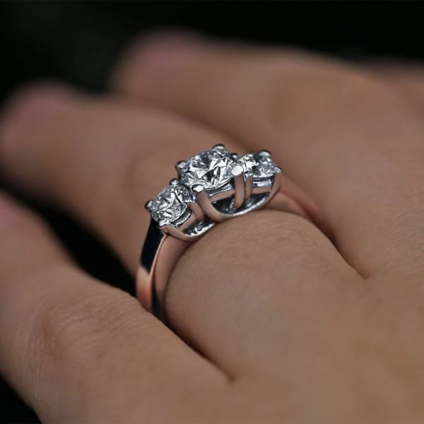 Dazzling Three-Stone Engagement Ring features 1.40ct of Total Diamonds PL-172690, Ring on a finger