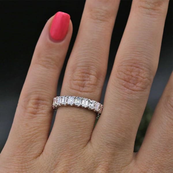 Diamond Eternity Band features 4.00ct of Emerald Diamonds BAN-23000, Ring on a finger 