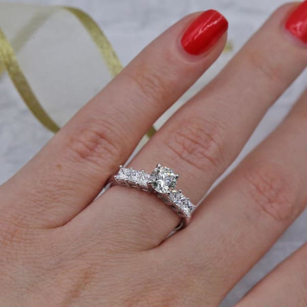 Engagement Ring features 0.69ct Round cut Natural diamond and 6 Princess cut side Diamonds ENG-8750, Ring on a finger