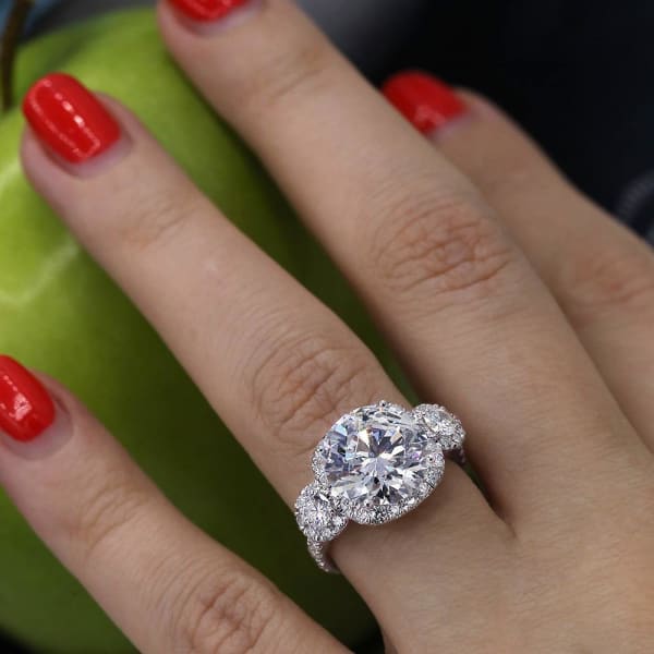 Fantastic Three stone Engagement ring with center round cut diamond ENG-64000, Ring on a finger 