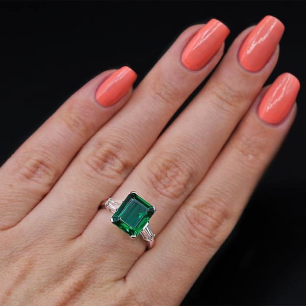 Platinum Cocktail Ring features with 6.00ct Green Emerald and 0.50ct Diamonds,  Ring on a finger 