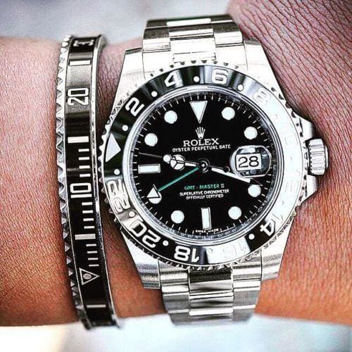 Speedometer bracelet Stainless steel cuff bracelet 1 pc. and a Black dial watch Rolex on the wrist