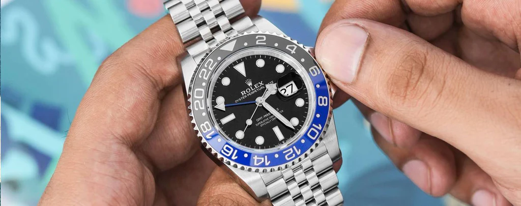 Close-up of Rolex GMT bezel showcasing rotating function and 24-hour markers