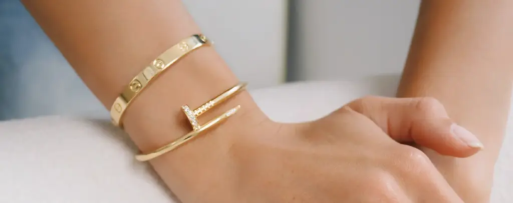 Appraising a luxury Cartier bracelet for sale.